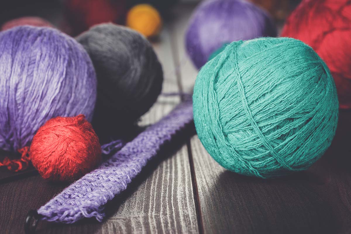 knitting-needles-and-balls-of-threads-PAB8MYG.jpg